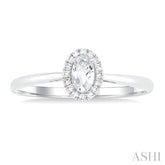 5x3 MM Oval Shape White Topaz and 1/20 Ctw Single Cut Diamond Halo Semi-Precious Ring in 14K White Gold
